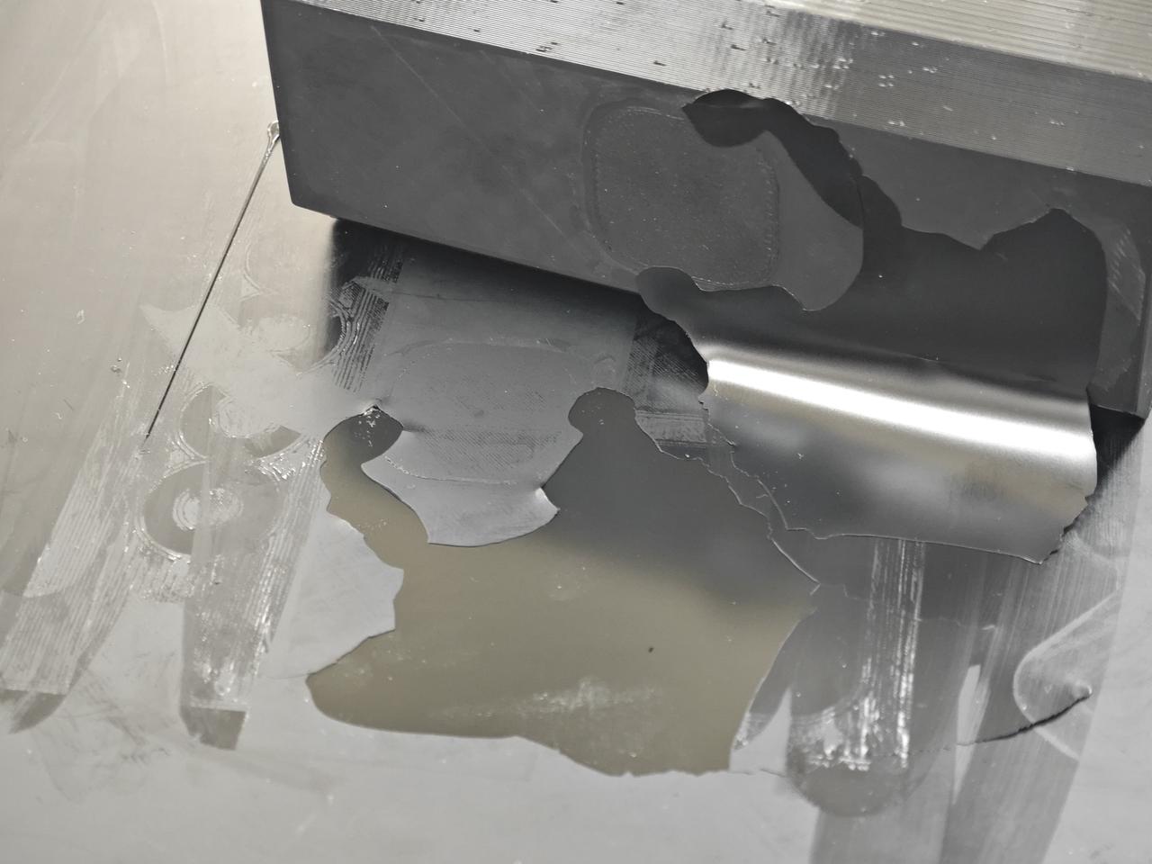 Damage to the build plate when removing the model if glue was not applied beforehand