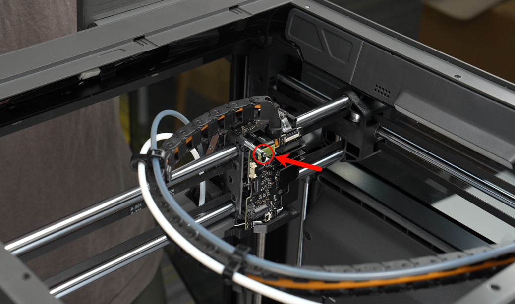 008_remove_the_screw_behind_the_right_lever.png