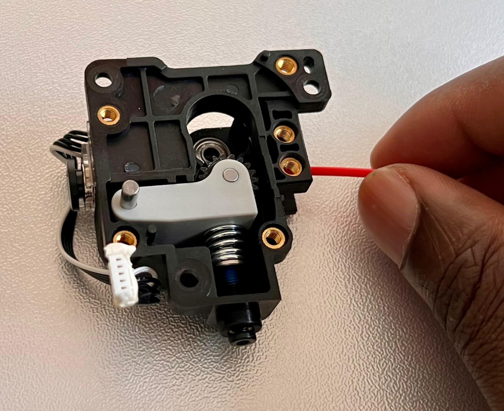 removing-filament-with-hand.png